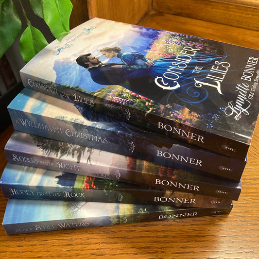 Covers of Books 4-8 in the Wyldhaven Series in a stack