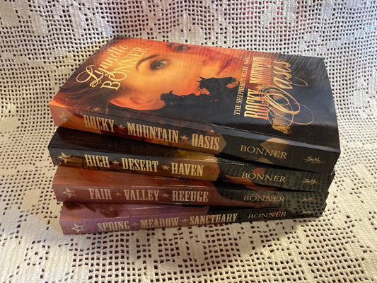 Covers of books 1-4 in the Shepherds Heart Series, a Christian historical Western Romance, in a stack